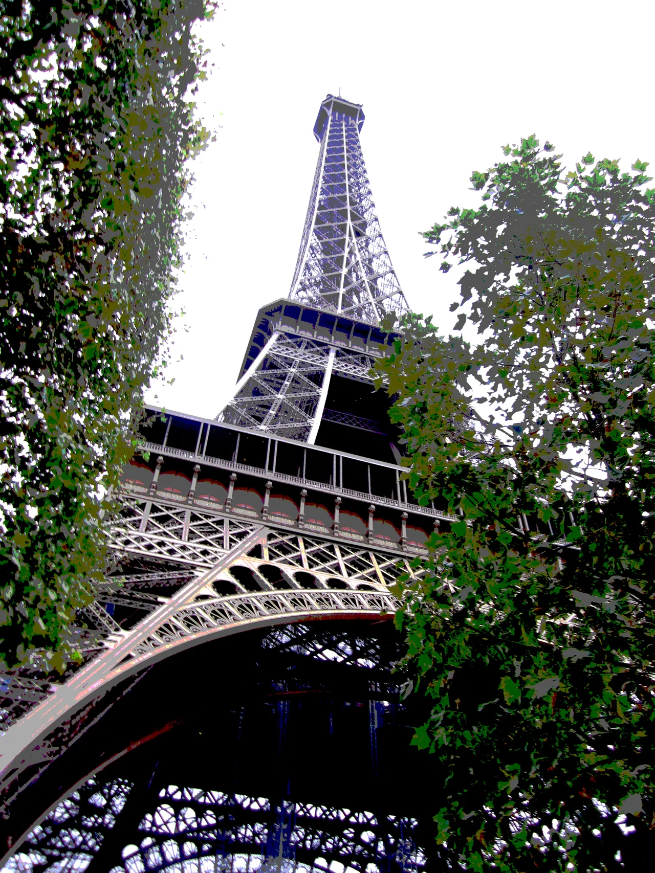Eiffel Tower from below through trees