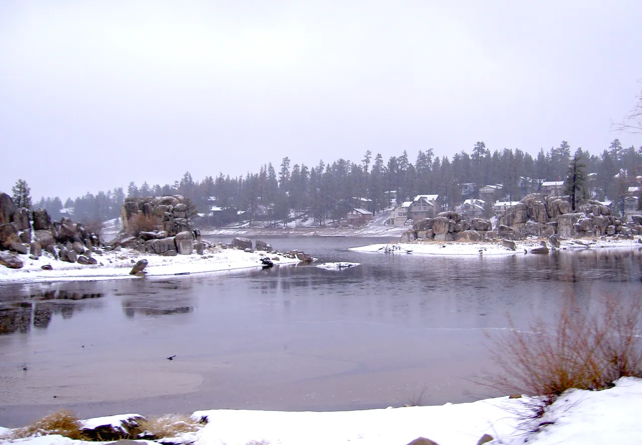 Big Bear Lake with snow on the shore