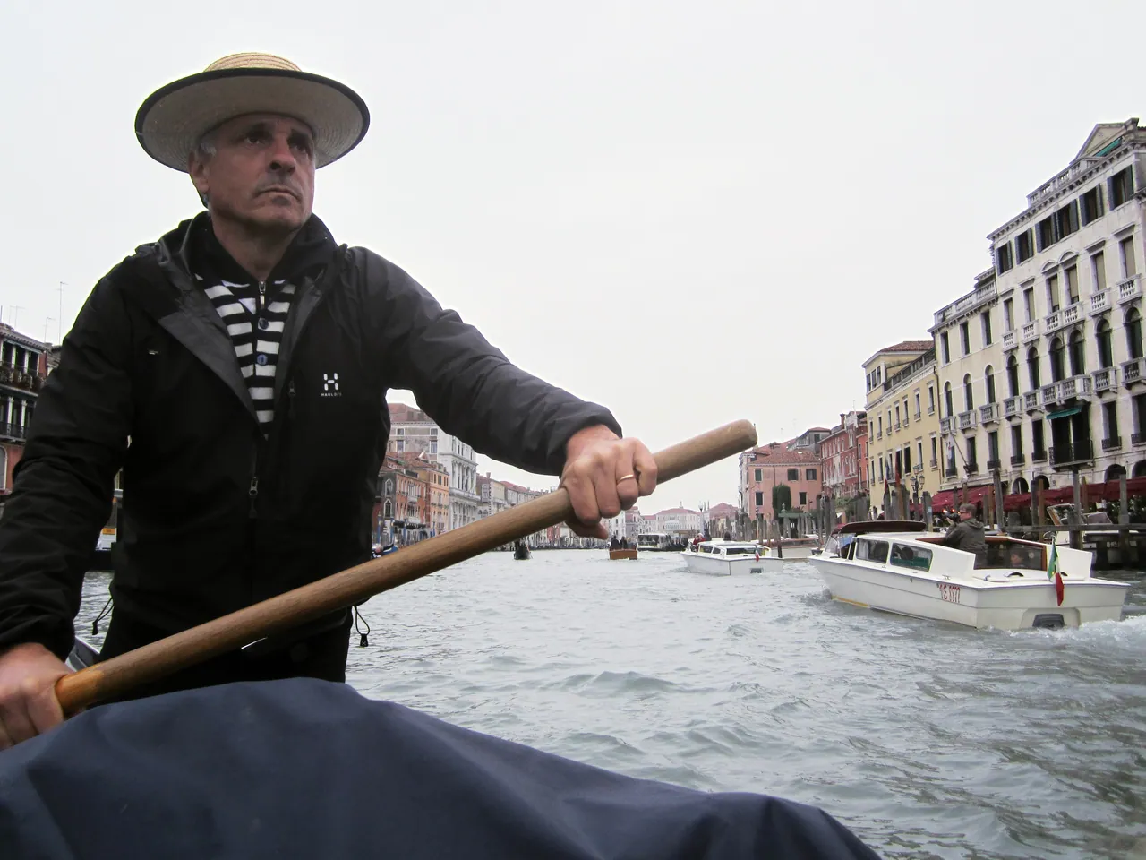 Gondolier rowing in Venice